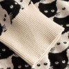 Cardigan Kanan Pepita Cats oat white von Dedicated.